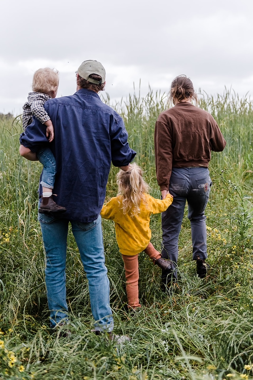 Woodstock Flour family facing into field of wheat